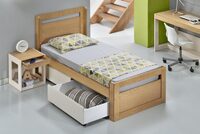 Children's room Frame Oak bed with wheeled drawers.
